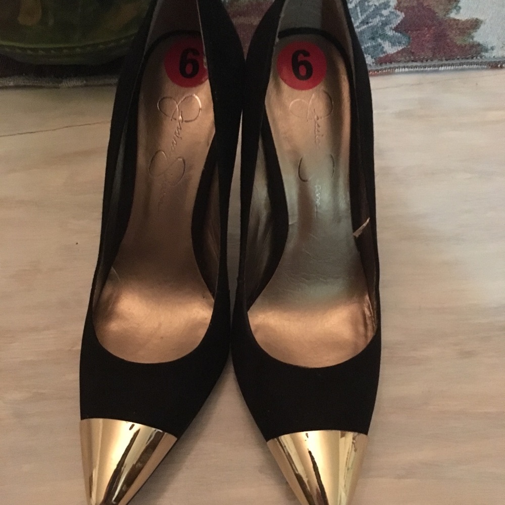 Black faux suede high heels with gold metal toe